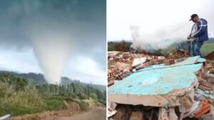 Tornado atinge área rural e deixa destroços com fumaça saindo dos escombros enquanto um homem observa o local