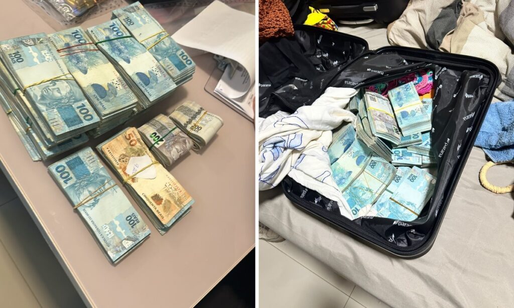Dinheiro em notas de cem e cinquenta reais empilhado em uma mesa e dentro de uma mala aberta
